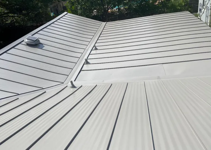 Solar attic fan installed on a metal roof for Roof Ventilation in Mexico